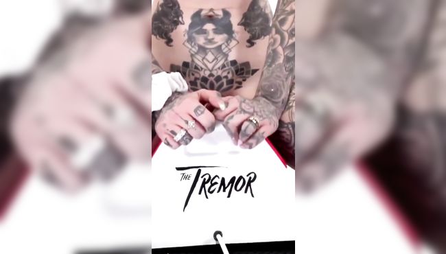 Tattooed baby rides a new toy